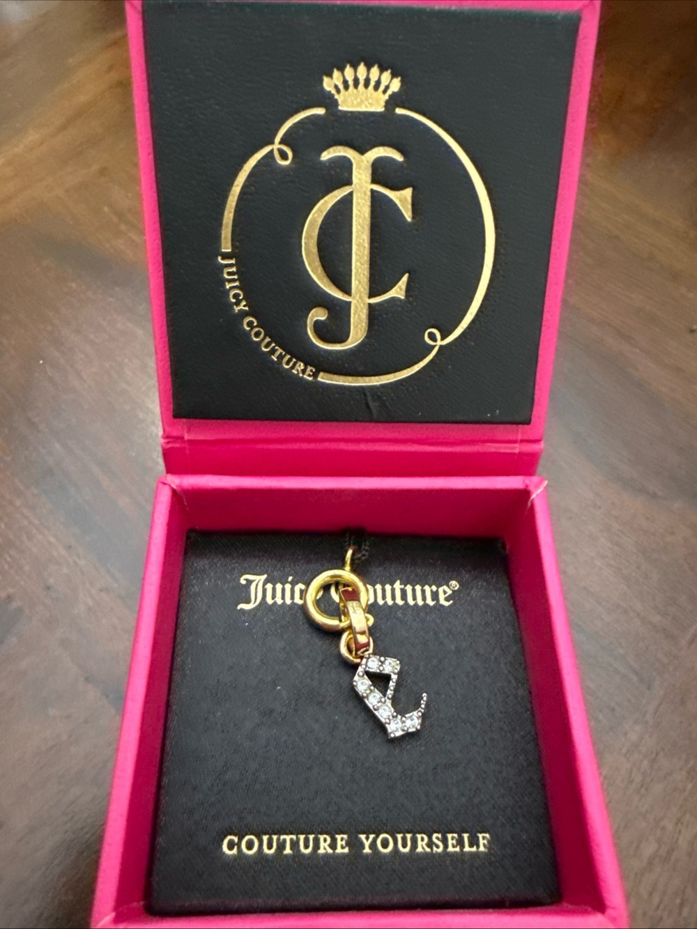 Vintage Juicy Couture Gold-tone Crystal 'E’ Charm Necklace with Pink Box Accent